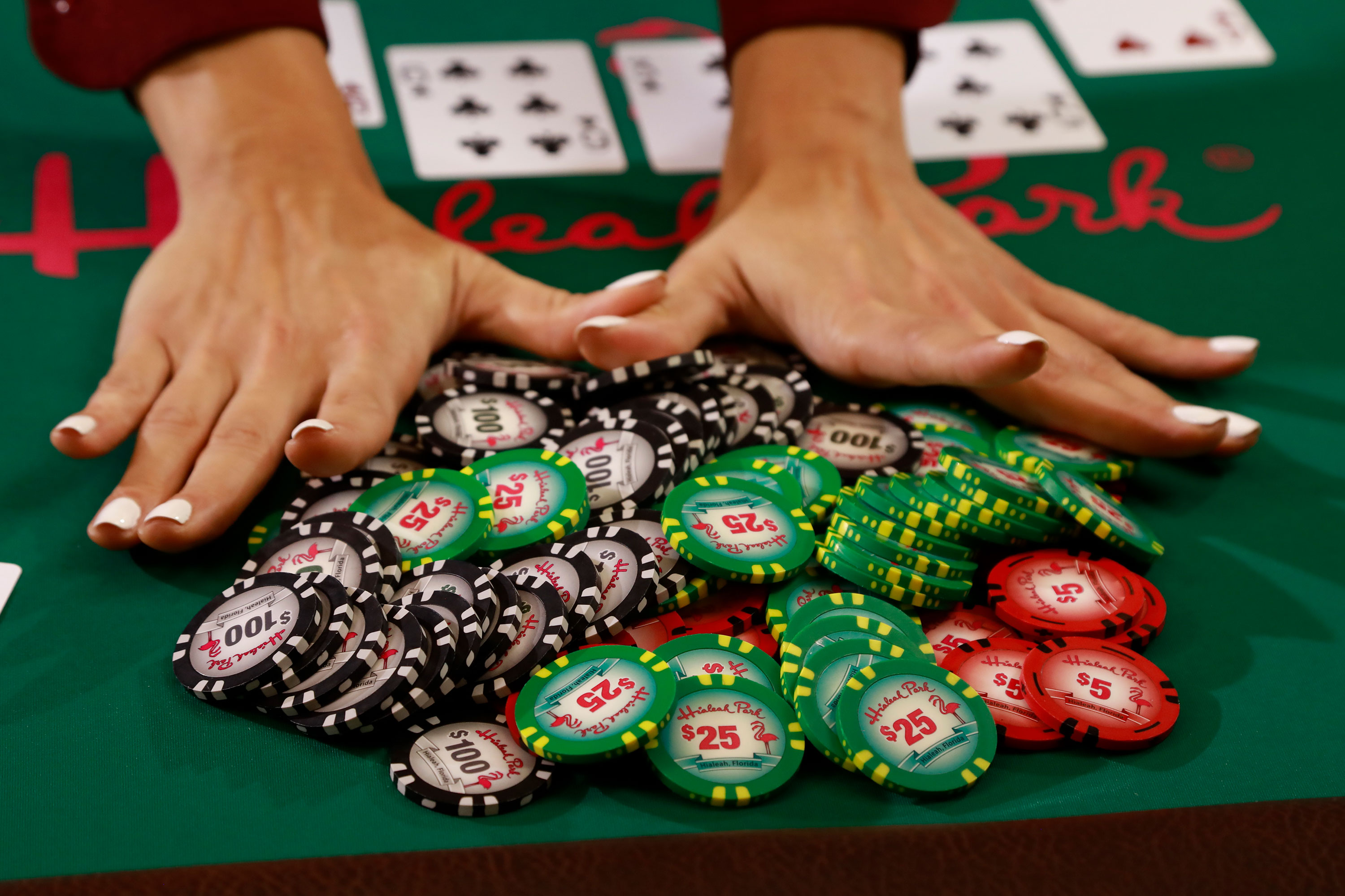 Woman pushing poker chips